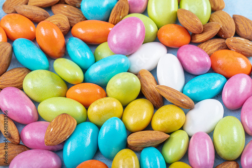 Traditional Turkish colorful coated almond candies.Colorful candies background top view, almond sweets. photo