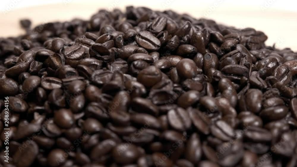 Close Up Shot Organic Whole Coffee Beans Turning Slowly