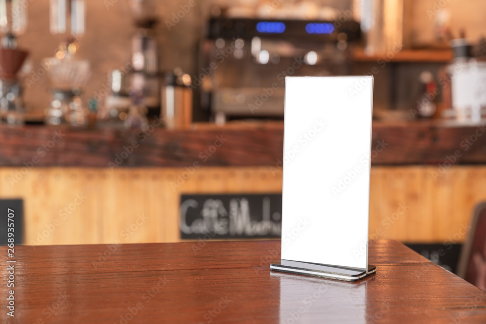 Menu frame standing on wood table in coffee shop. space for text marketing promotion Menu frame standing on wood table in coffee shop. space for text marketing promotion