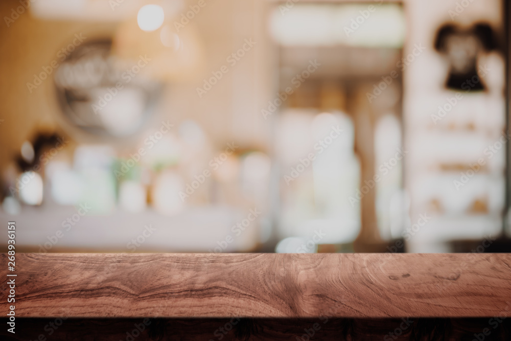 Empty wood table with blur cafe background. Empty wood table with blur cafe background.