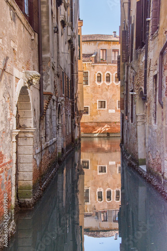 Narrow canals are famous and typical in Venice,Italy, 2019