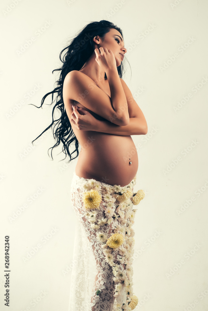 pregnancy. Maternity preparation. life birth expectation. Love. womens  health. girl with big belly. beautiful pregnant woman in spring flower skirt.  future mother have baby inside. i love my baby Stock Photo