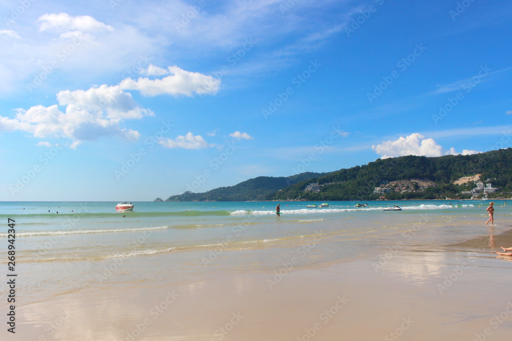 Phuket Province, Thailand - November17, 2017: Nai Harn Beach. Beautiful beach and sea in Phuket, Thailand.   Traveller from around the world come to relax in the summer holidays.