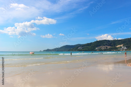 Phuket Province, Thailand - November17, 2017: Nai Harn Beach. Beautiful beach and sea in Phuket, Thailand. Traveller from around the world come to relax in the summer holidays.
