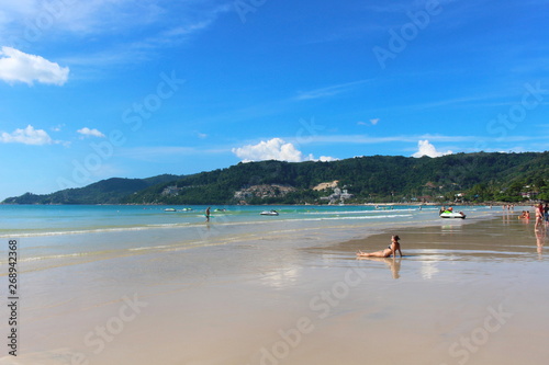 Phuket Province, Thailand - November17, 2017: Nai Harn Beach. Beautiful beach and sea in Phuket, Thailand. Traveller from around the world come to relax in the summer holidays.