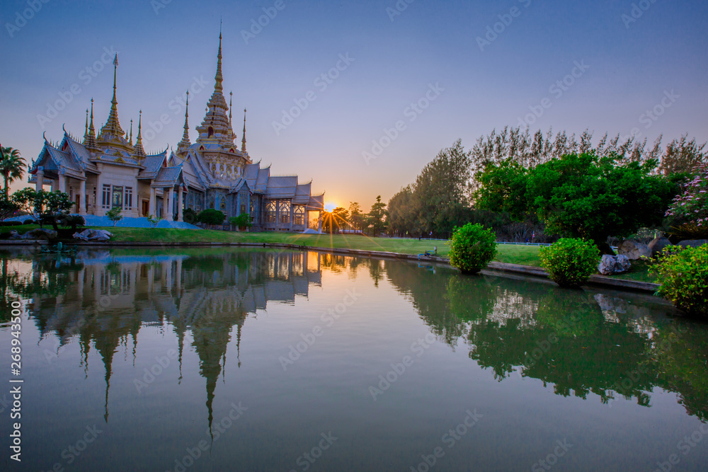 Wallpaper Wat Lan Boon Mahawihan Somdet Phra Buddhacharn(Wat Non Kum)is the beauty of the church that reflects the surface of the water, popular tourists come to make merit and take a public photo 