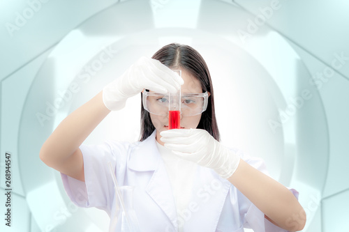 scientist Look at the test tube to analysis.