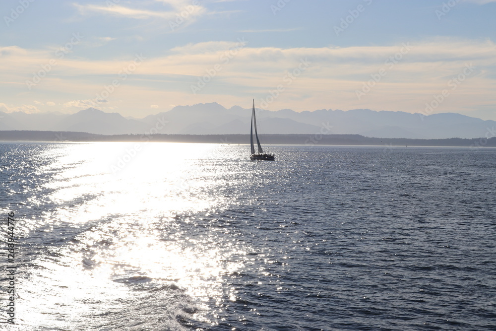 Fototapeta premium Sailing boat in the sea at sunset