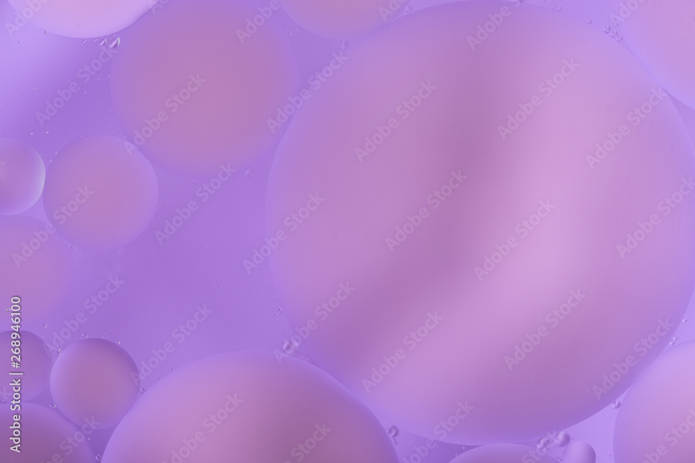 oily drops in water with colorful background, close-up oily drops in water with colorful background, close-up
