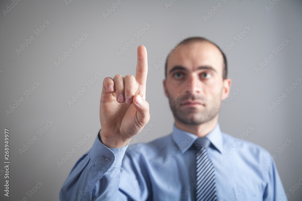 Businessman pointing or touching finger in screen. Businessman pointing or touching finger in screen.