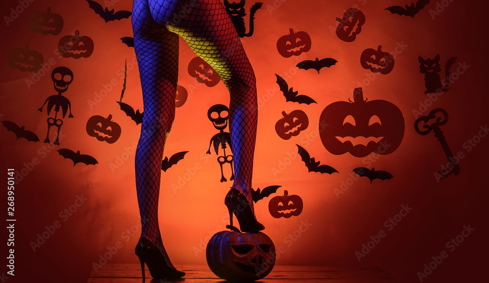 The Most Popular Candy for Halloween. Woman shows a beautiful ass or butt.  Female with sexy