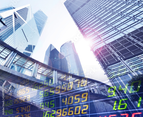 Canvas Print Stock Market Exchange on a skyscraper in Hong Kong background.