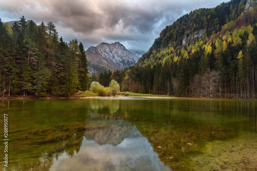 View of Mount Skuta. Plansar Lake or Plansarsko jezero on valley Zgornje Jezersko in northern Slovenia photo