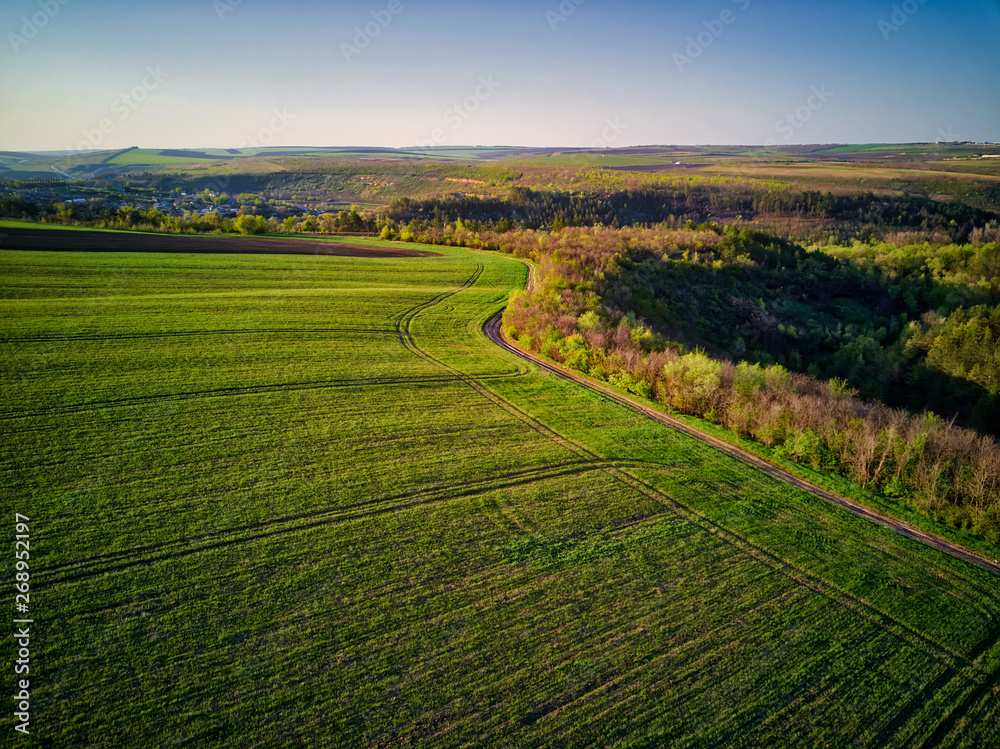 Sunset light over cultivating field in the spring Sunset light over cultivating field in the spring