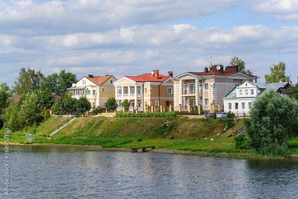 Russia, Tver region, August 2018. Beautiful house on the river bank in the summer.