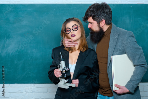 College Students and teacher in Love together. Sexology lesson. Male teacher with students. Love in university. Sexy student. University studying friends studying in classroom.