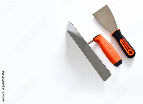 Construction trowel on white background with trowel, close-up