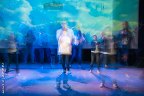 Beautiful movements in dance, shot on long exposure. Children ensemble. Moscow. Russia