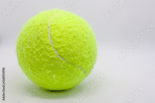 Yellow tennis ball closeup on a white background. © Валерий Елистратов