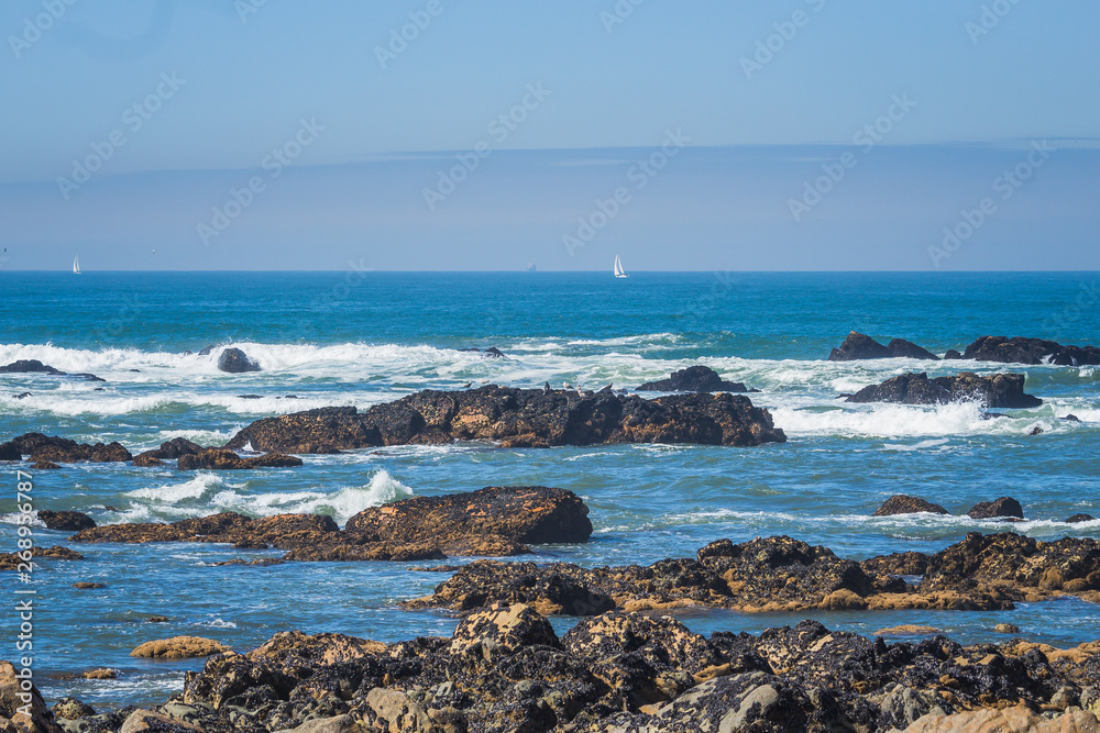 Seascape with a rocky shore taken near Porto, Portugal