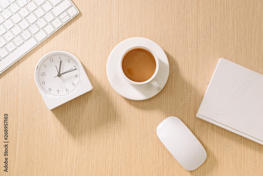 Modern white office desk with keyboard, mouse, notebook, clock and cup of coffee. Top view with copy paste. Business and strategy concept mockup. Modern white office desk with keyboard, mouse, notebook, clock and cup of coffee. Top view with copy paste. Business and strategy concept mockup.