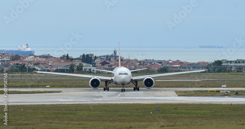 Airplane taxiing on runway of the airport
