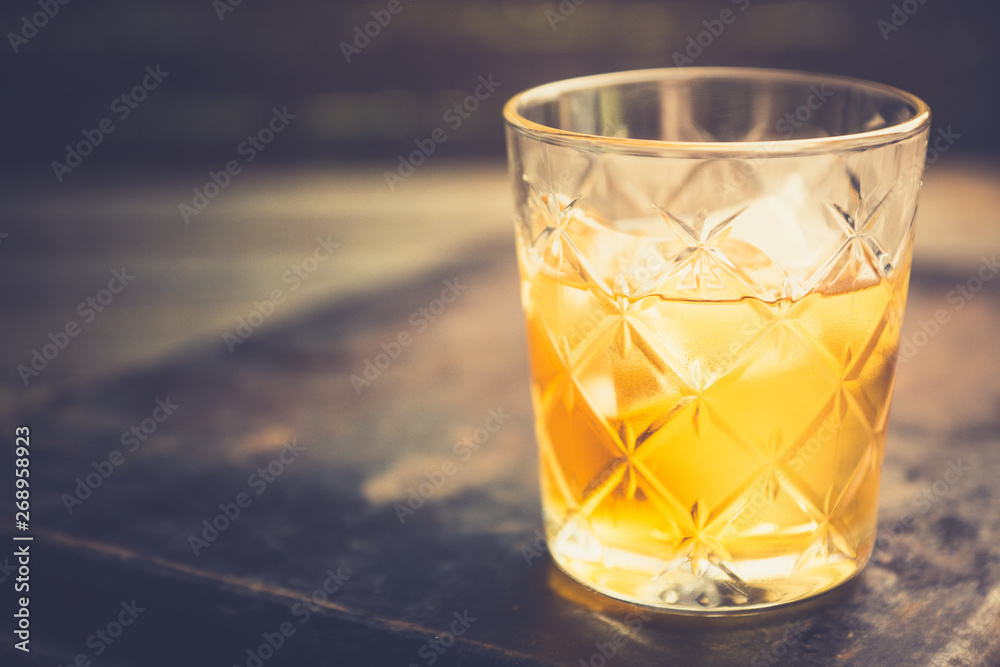 Old fahioned cocktail on the rustic background. Selective focus. Shallow depth of field. Old fahioned cocktail on the rustic background. Selective focus. Shallow depth of field.