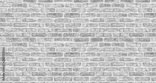 White washed brick wall texture. Rough light gray brickwork. Whitewashed vintage background