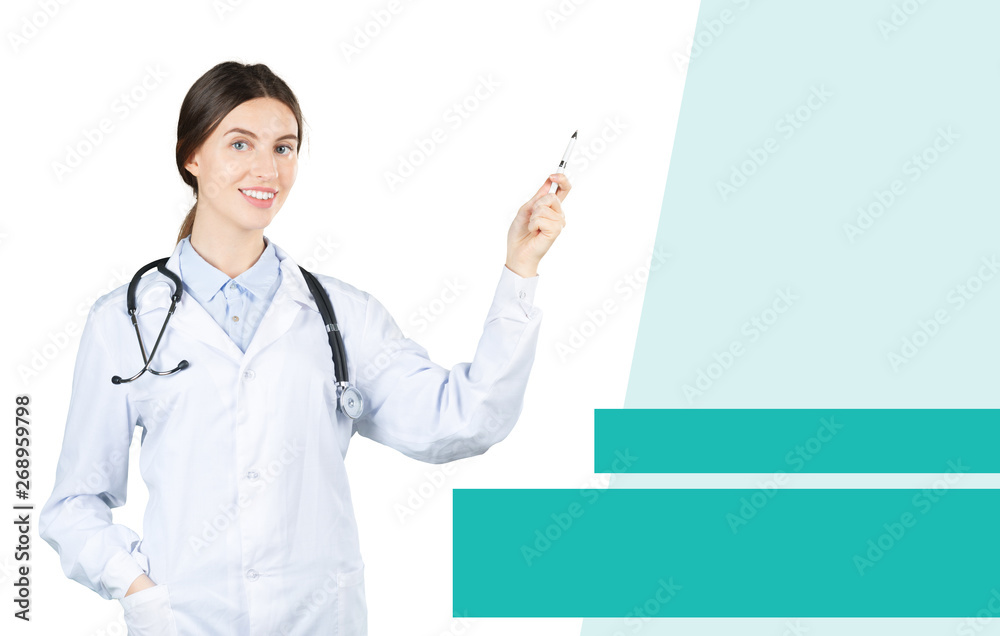 Smiling female doctor in white coat with stethoscope and clipboard pointing finger Smiling female doctor in white coat with stethoscope and clipboard pointing finger