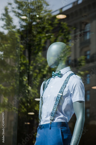 mannequins with modern clothes in fashion store display window  © Наталья Маяк