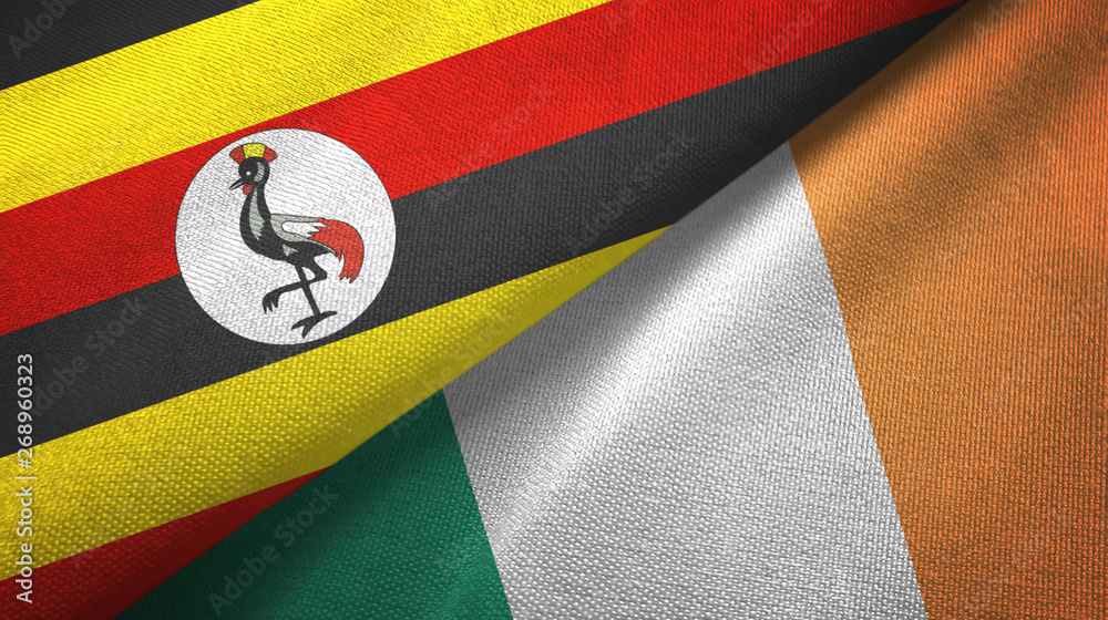 Fototapeta premium Uganda and Ireland two flags textile cloth, fabric texture