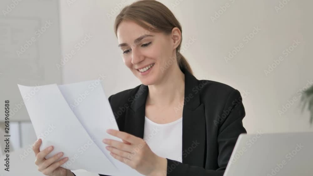 Young Businesswoman Reading Important Papers Young Businesswoman Reading Important Papers
