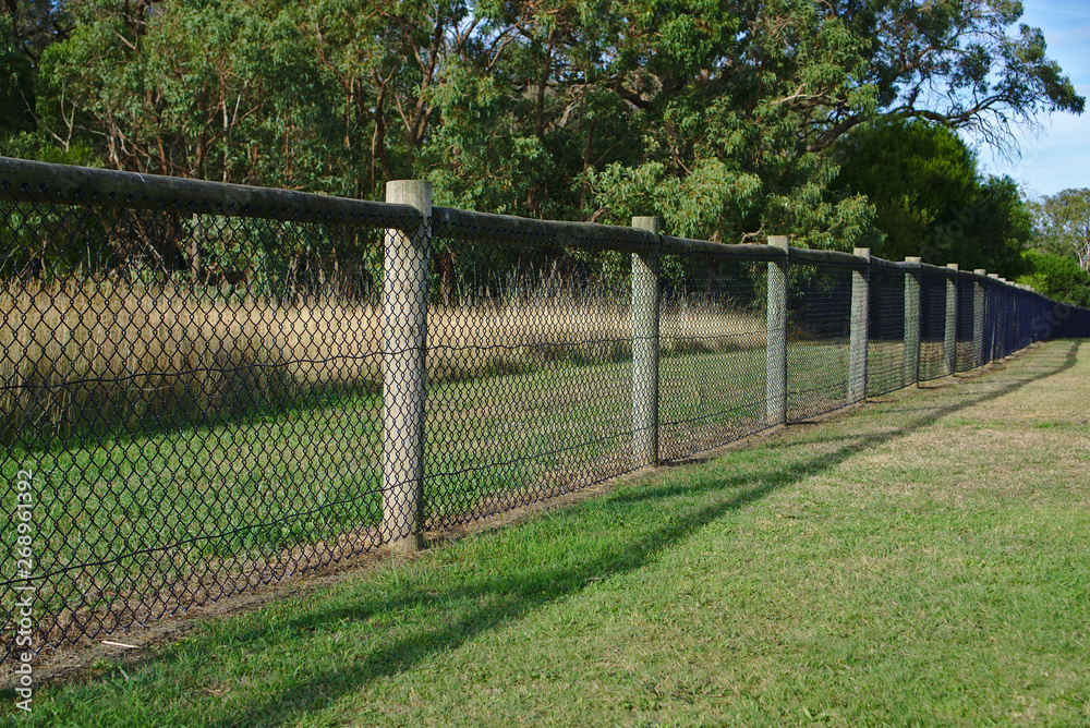 Chain link mesh wired wooden gate