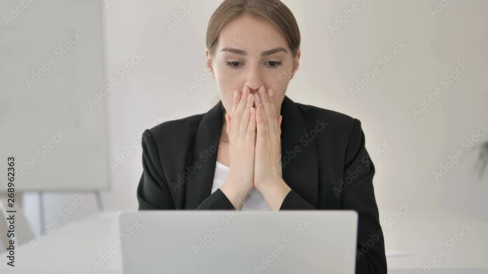 Close Up of Shocked Young Businesswoman Wondering at Work Close Up of Shocked Young Businesswoman Wondering at Work