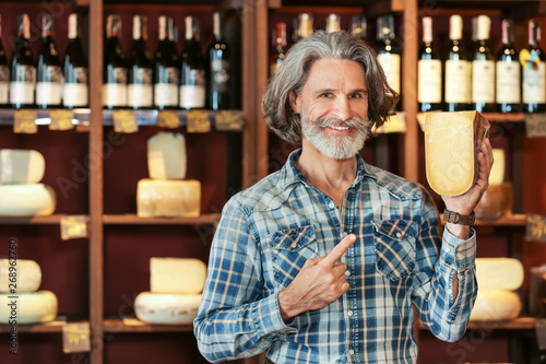 Business owner with cheese ...