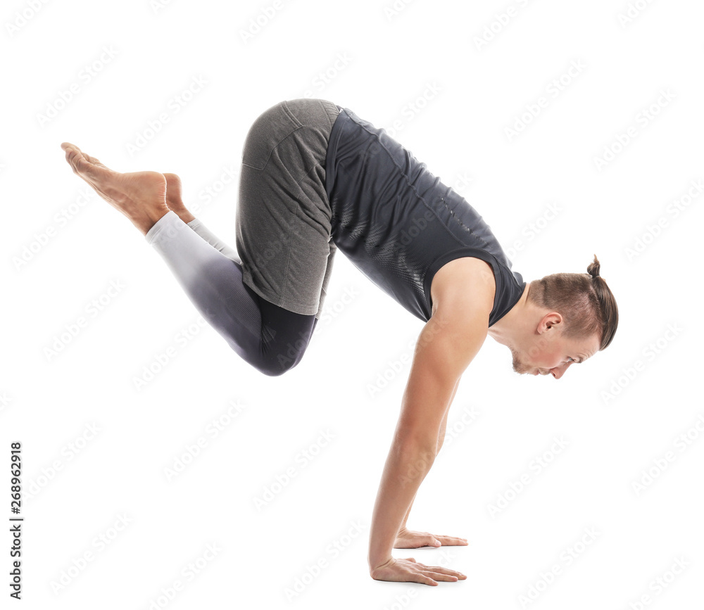 Sporty man practicing yoga on white background Sporty man practicing yoga on white background
