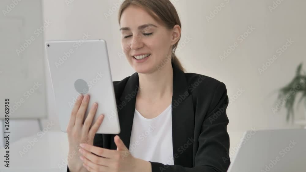 Online Video Chat on Tablet by Young Businesswoman Online Video Chat on Tablet by Young Businesswoman