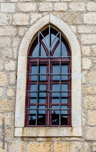 Window in the wall of an old building in Dubrovnik.