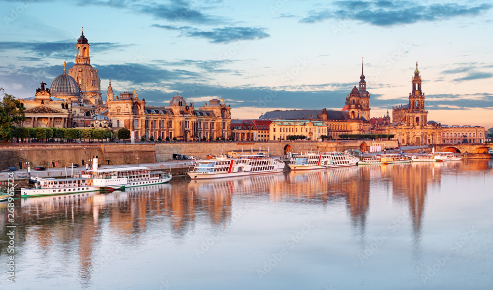 Dresden. Germany, during twilight blue hour with reflection of the city in Elbe River.