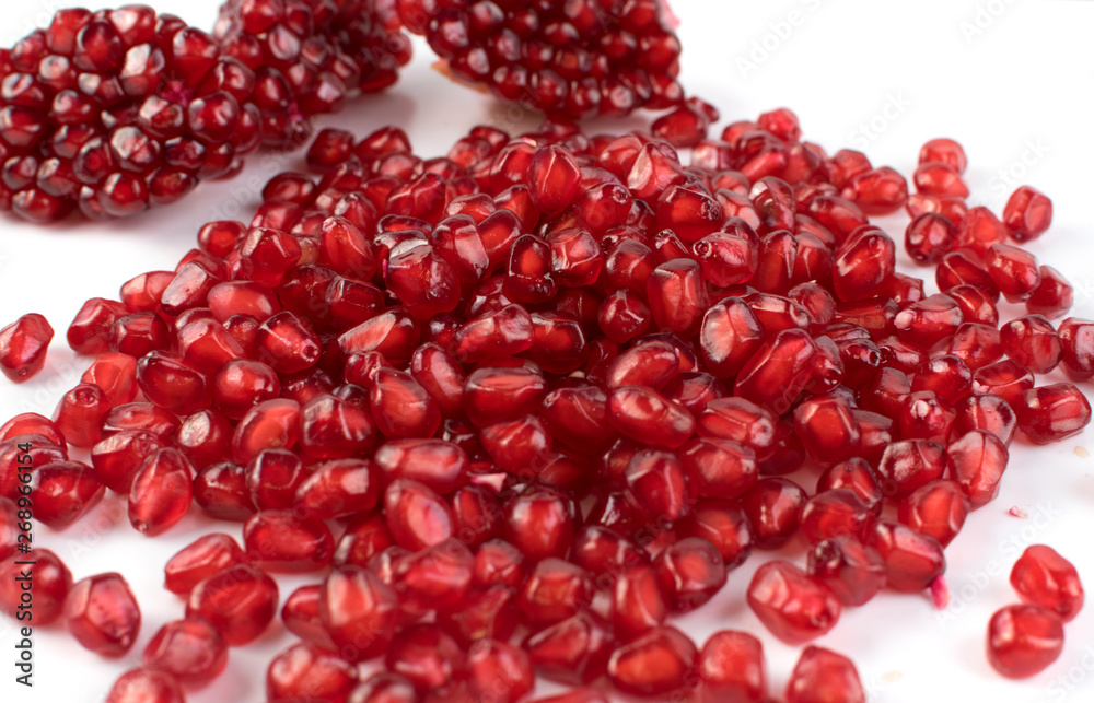Scattered Pomegranate Seeds Isolated on White Background Scattered Pomegranate Seeds Isolated on White Background