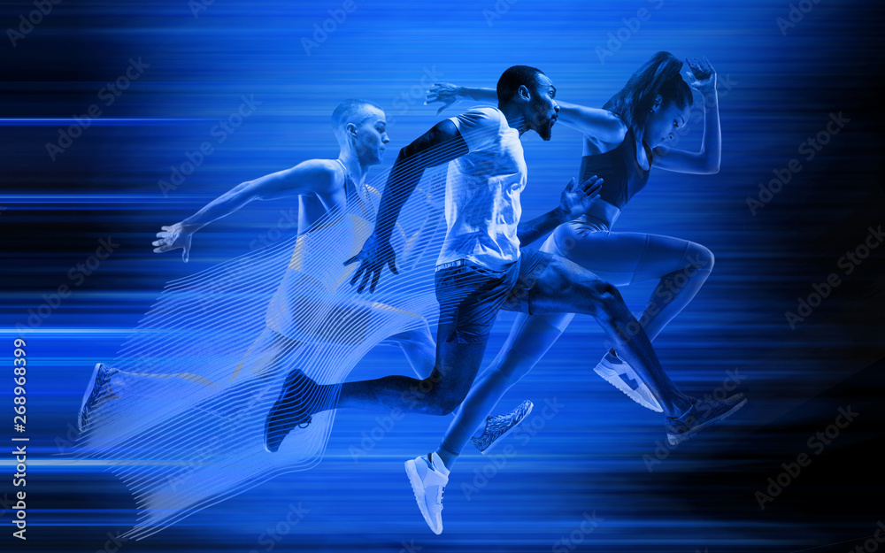Young african-american and caucasian men and woman running isolated on blue studio background. Silhouette of jogging athletes with shadows in neon light. Movement or motion. Creative collage.