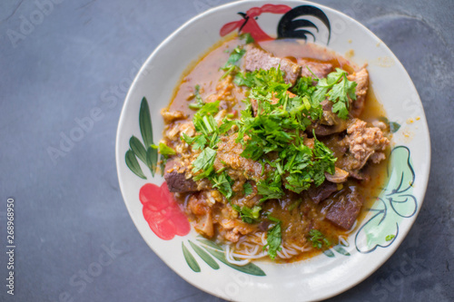 Nam Nguan Noodle, Rice noodles with spicy pork sauce. photo