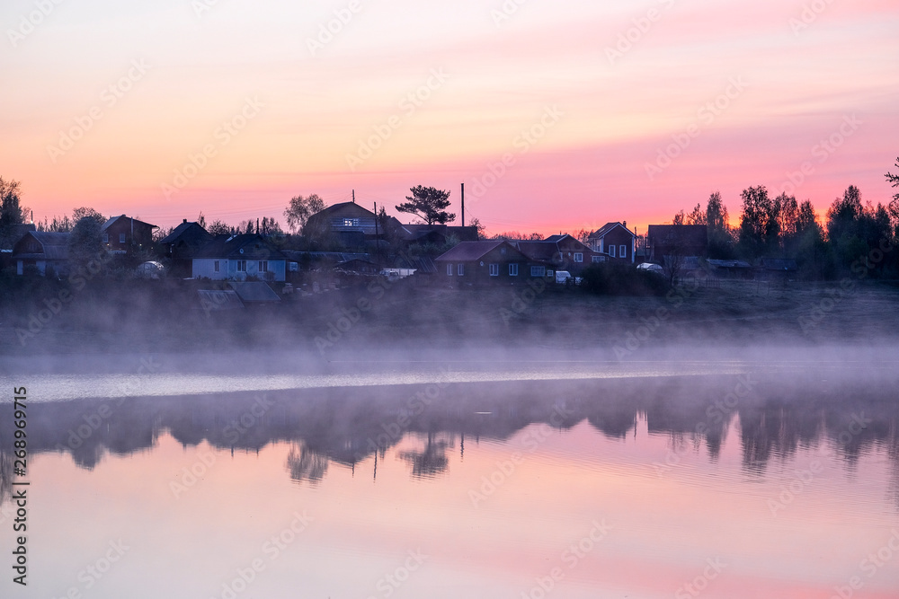 Landscape with the image of village on lake Seliger in Russia