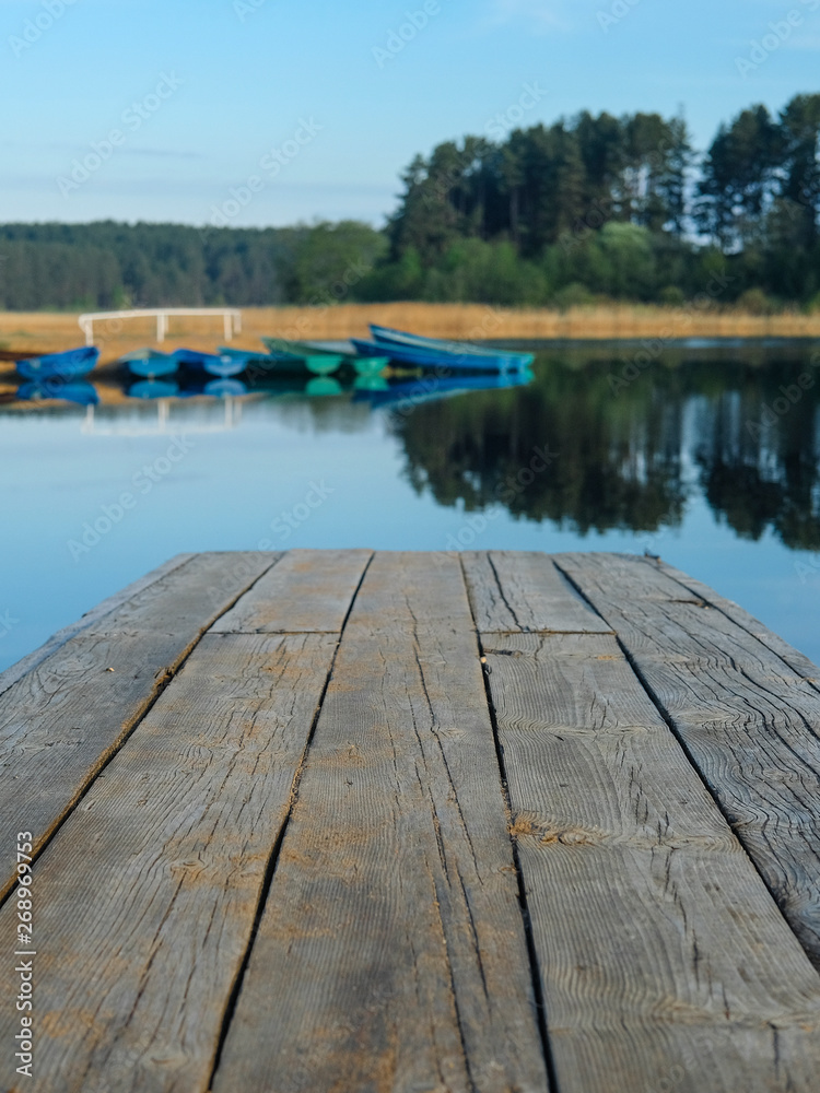 Naklejka premium Landscape with the image of pier on lake Seliger in Svetlitsa village, Russia