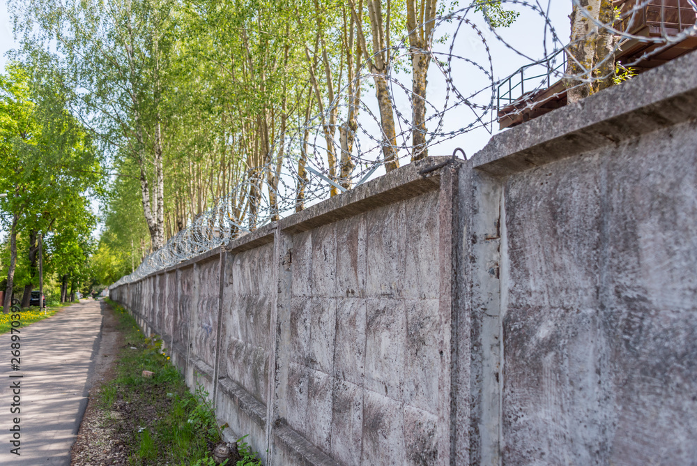 Concrete Wall with Razor Wire in Riga Latvia