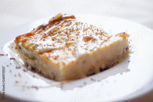 Cottage cheese casserole with condensed milk on a plate. Baking from cottage cheese.