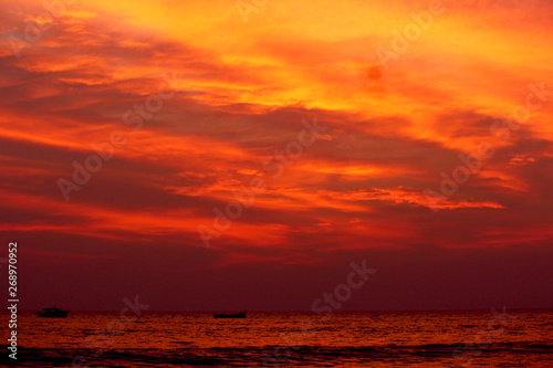 Warm beautiful Sunset on the coast of Kerala, India. A view from Bekal beach