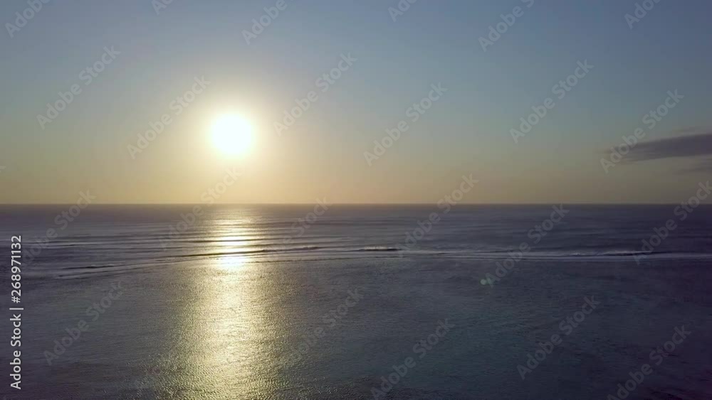 Golden hour sunset over blue sea Golden hour sunset over blue sea