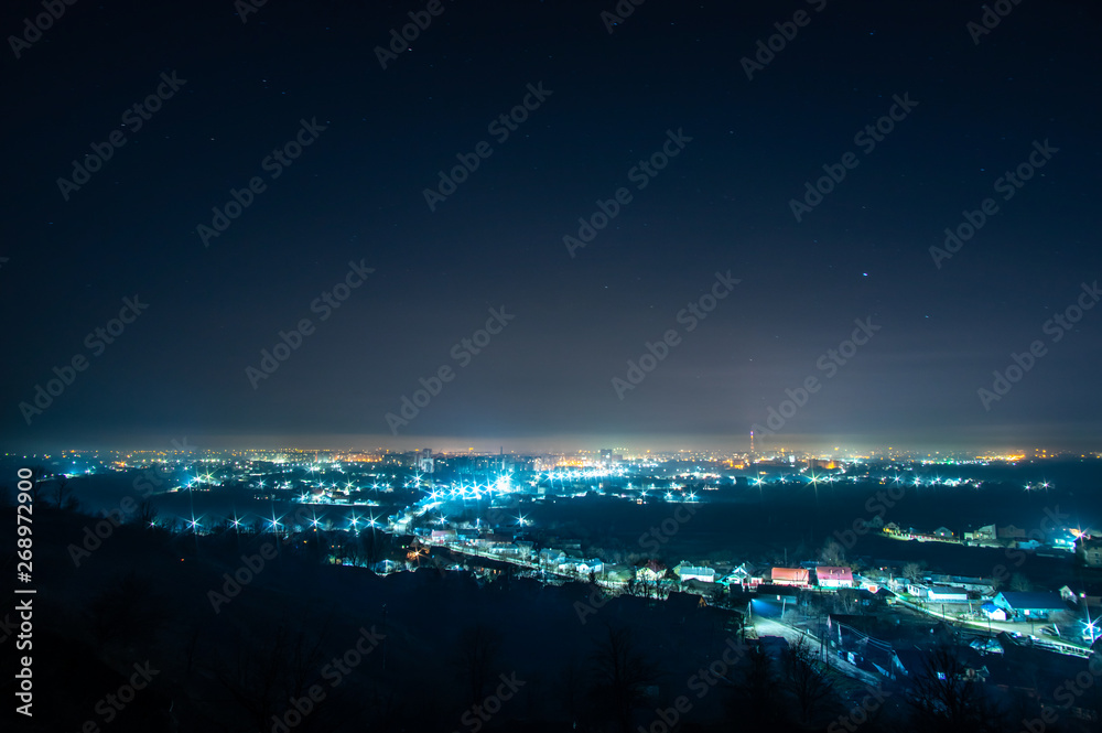 Naklejka premium Night city in the haze