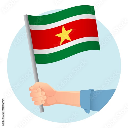 Suriname flag in hand
